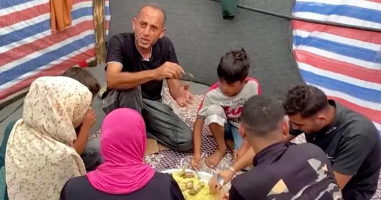 Gazan family who fled Israeli bombing eat first cooked meal in three weeks