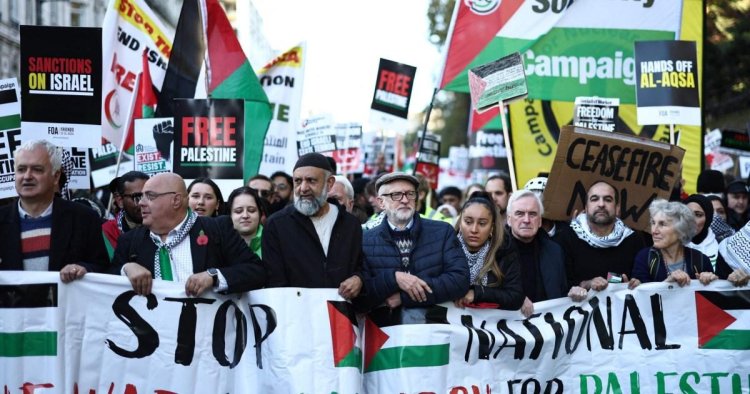 Hundreds of thousands join Pro-Palestine march after far-right counter-protesters clash with police – latest news