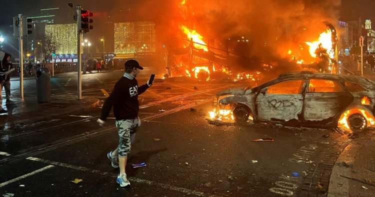 Dublin riots – live: Clean up begins after hooligans set city on fire after children injured in knife attack