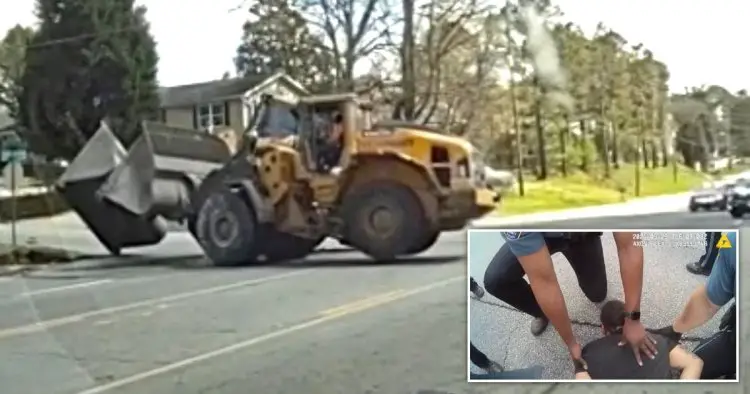 Man steals digger and is rammed off road by another digger after slow-speed chase