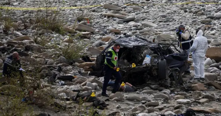 Eight killed after car crashes into river during police chase